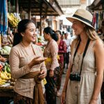 Wisatawan sedang berinteraksi ramah menggunakan panggilan khas Bali dengan warga lokal di pasar tradisional